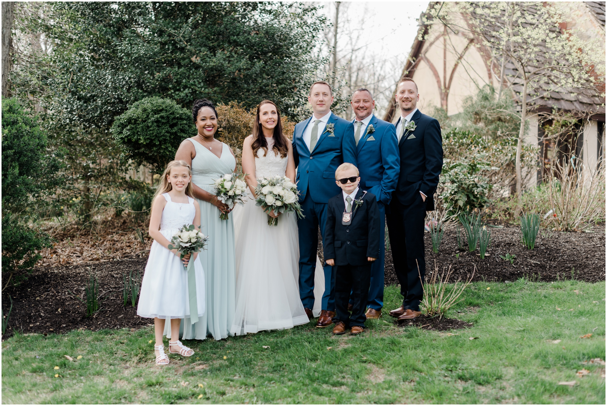 Light Blue Bridesmaid Dresses with Royal Blue Groomsmen Suits Spring Wedding Bridal Party Photos by Megan Bennett Photography