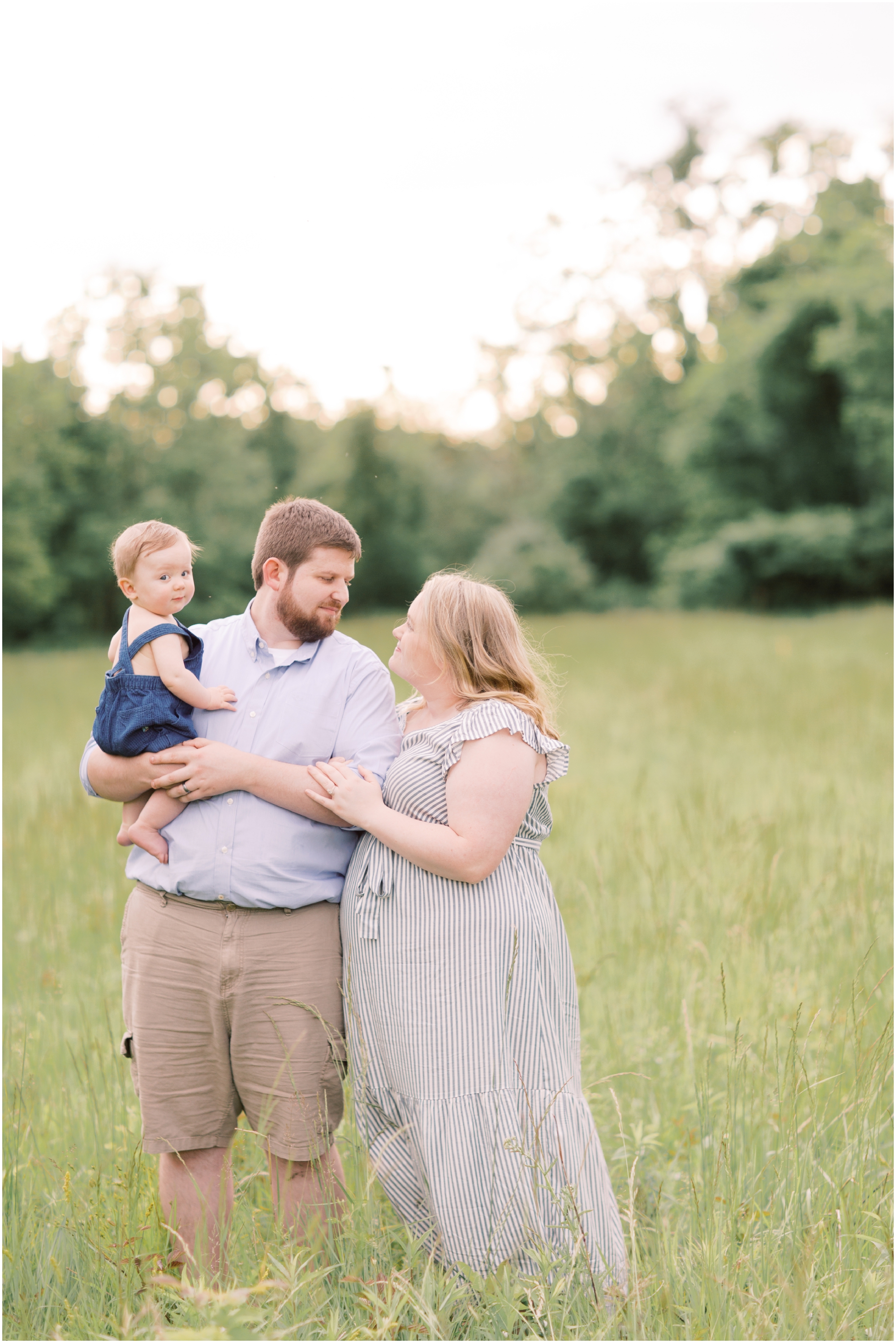 Family Portraits in a Farm Field with neutral and blue outfits