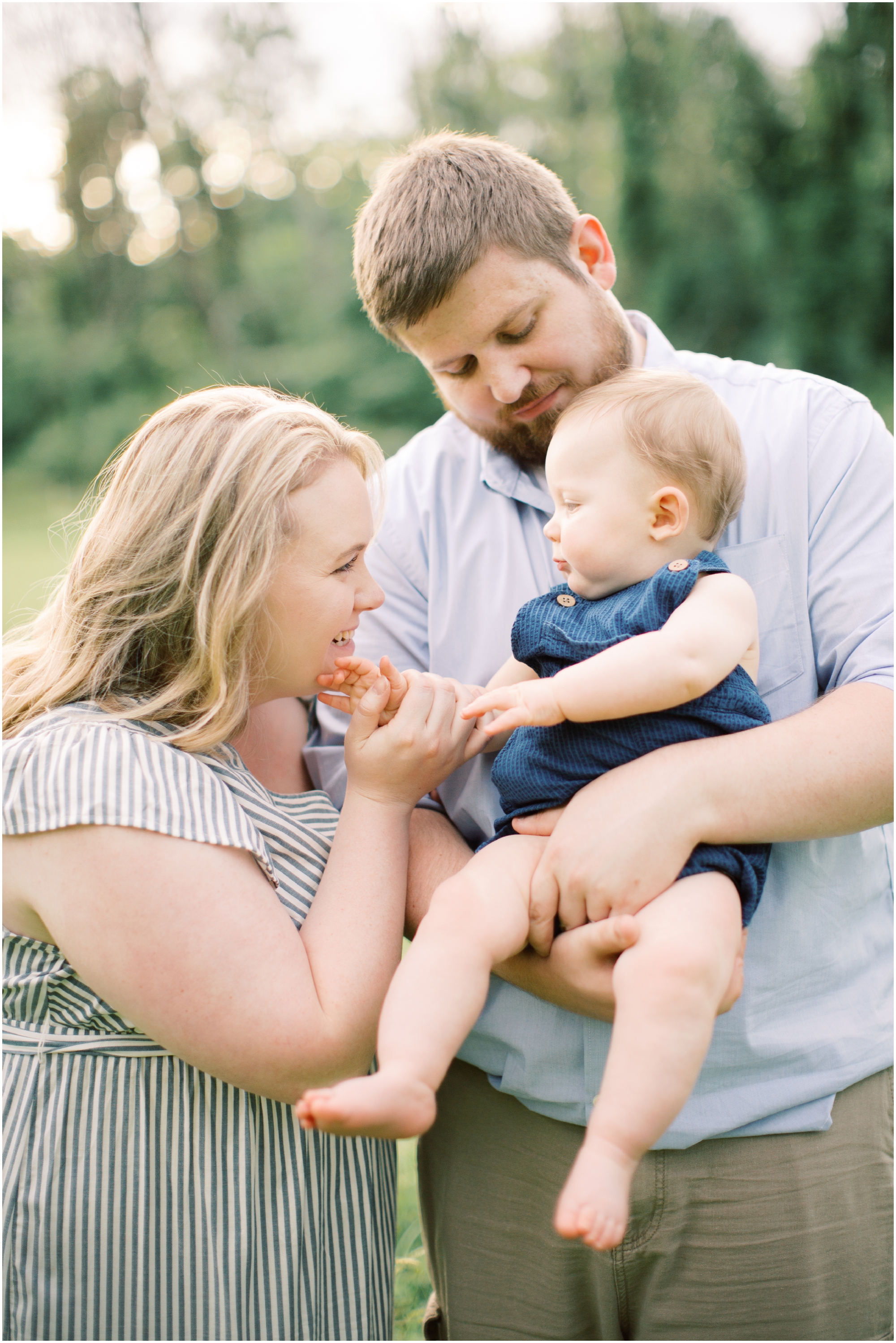 Family Portraits in a Farm Field with neutral and blue outfits