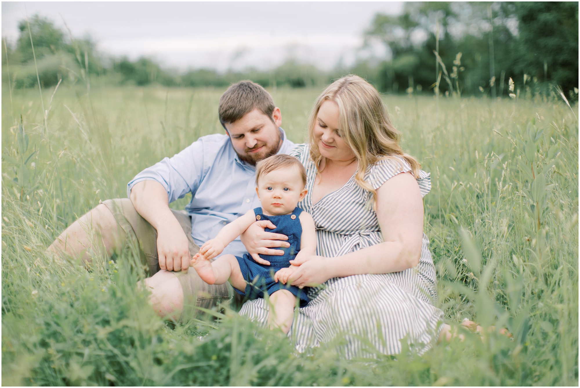 Family Portraits in a Farm Field with neutral and blue outfits