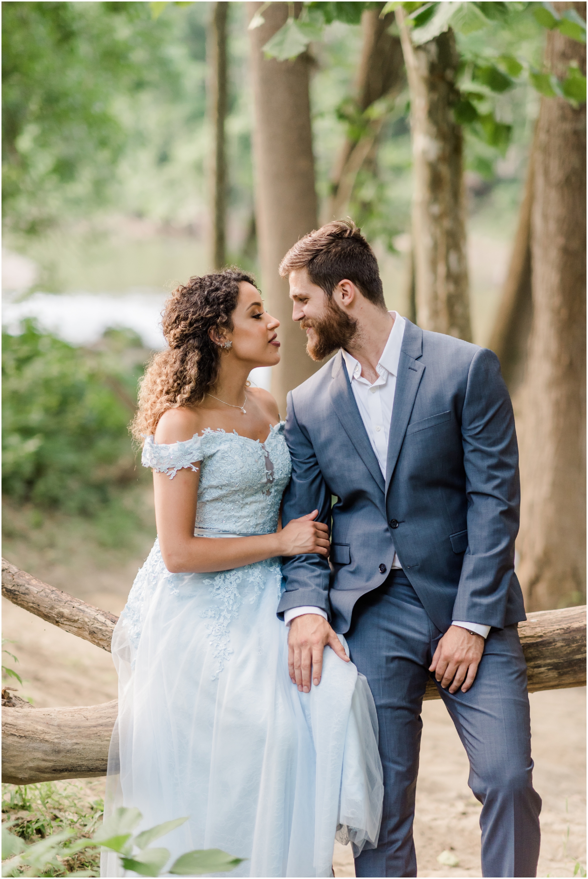A Romantic Ellicott City Engagement at the Patapsco Valley State Park featuring a Creek, Fun Couple, and Light Blue Dress #ellicottcityphotographer #patapscovalleystatepark #MarylandWeddingPhotographer
