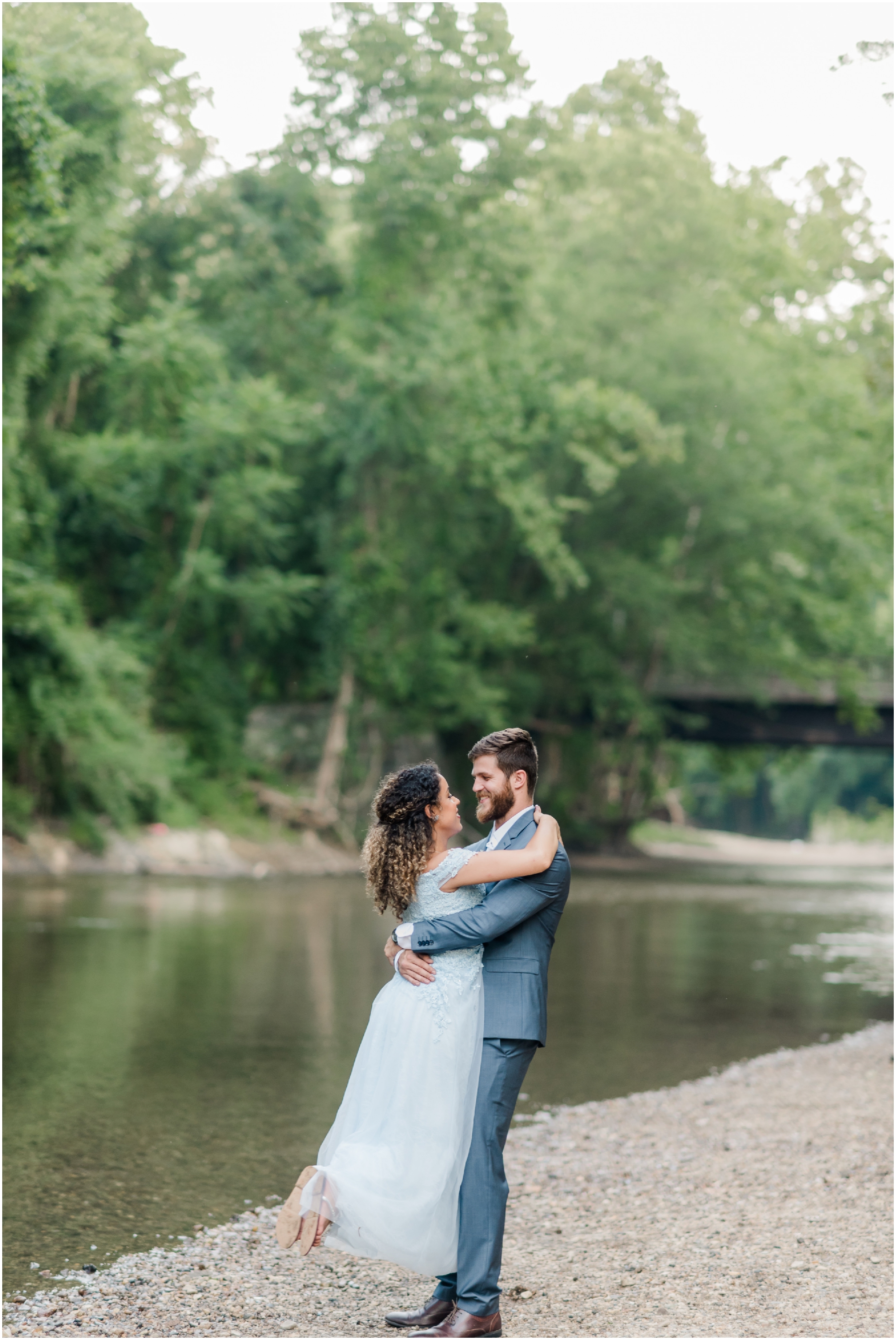 A Romantic Ellicott City Engagement at the Patapsco Valley State Park featuring a Creek, Fun Couple, and Light Blue Dress #ellicottcityphotographer #patapscovalleystatepark #MarylandWeddingPhotographer
