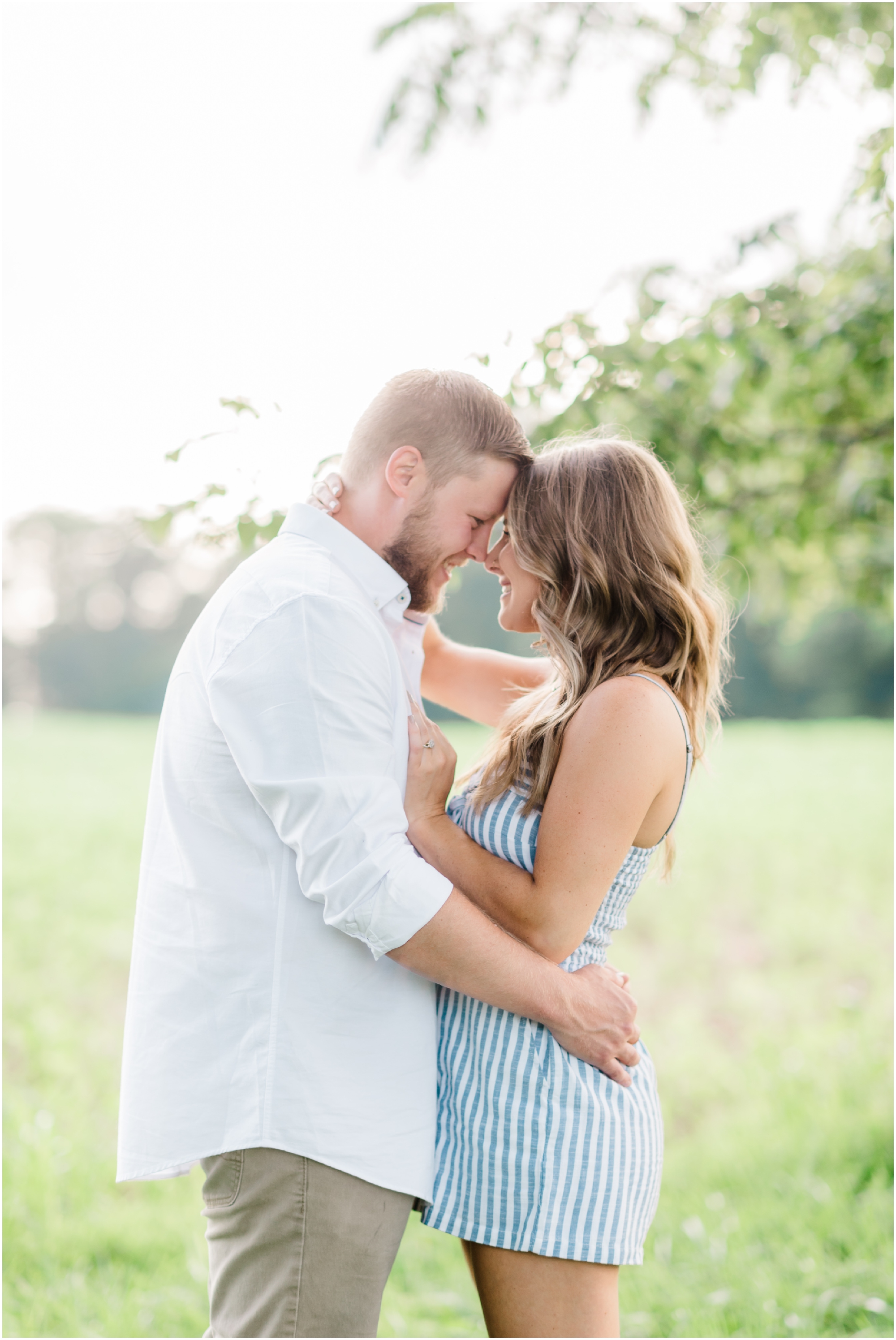 Summer farm engagement featuring blue and white outfits, a rose gold ring, and a family farm in Carroll County Maryland by Wedding Photographer Megan Bennett Photography