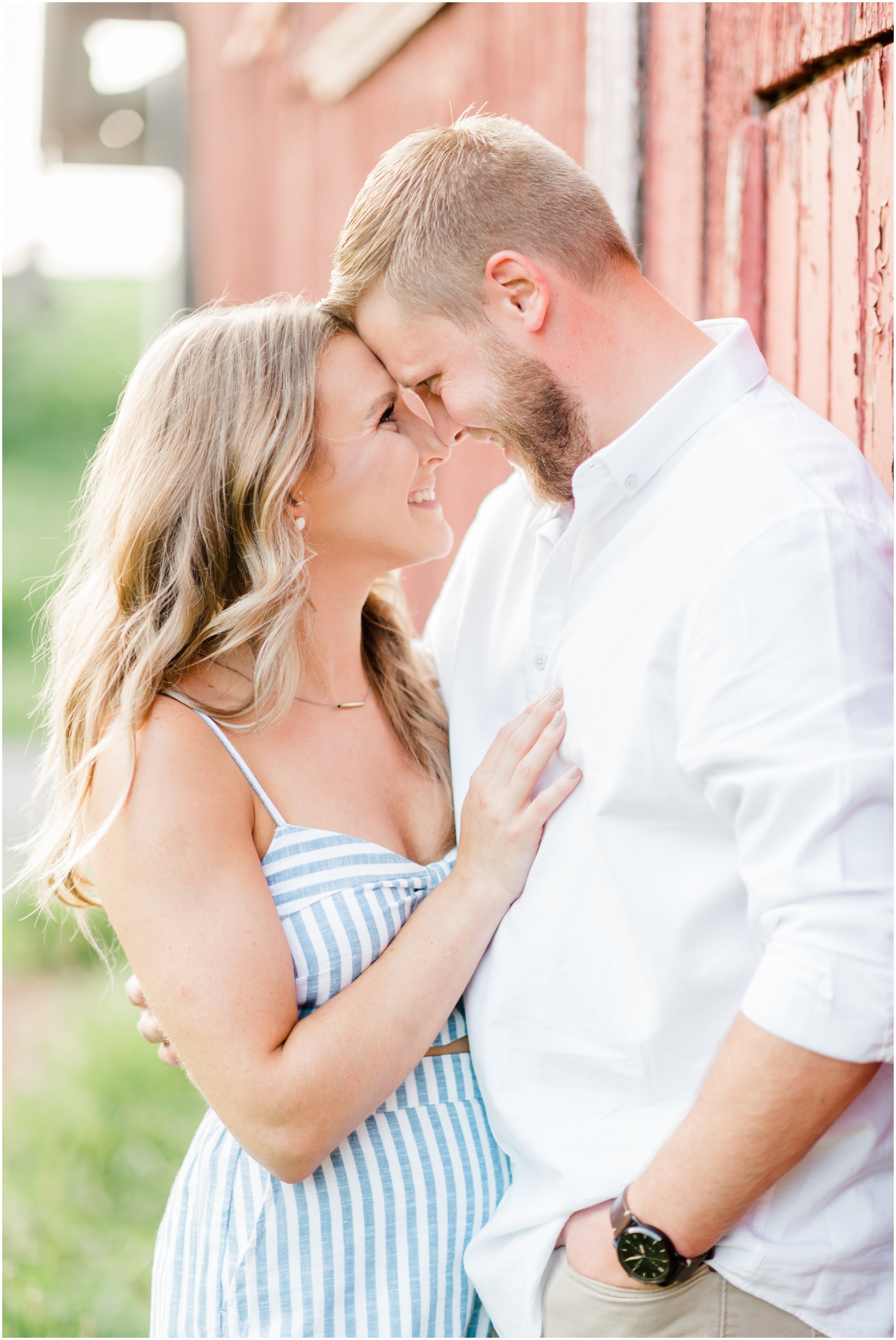 Summer farm engagement featuring blue and white outfits, a rose gold ring, and a family farm in Carroll County Maryland by Wedding Photographer Megan Bennett Photography