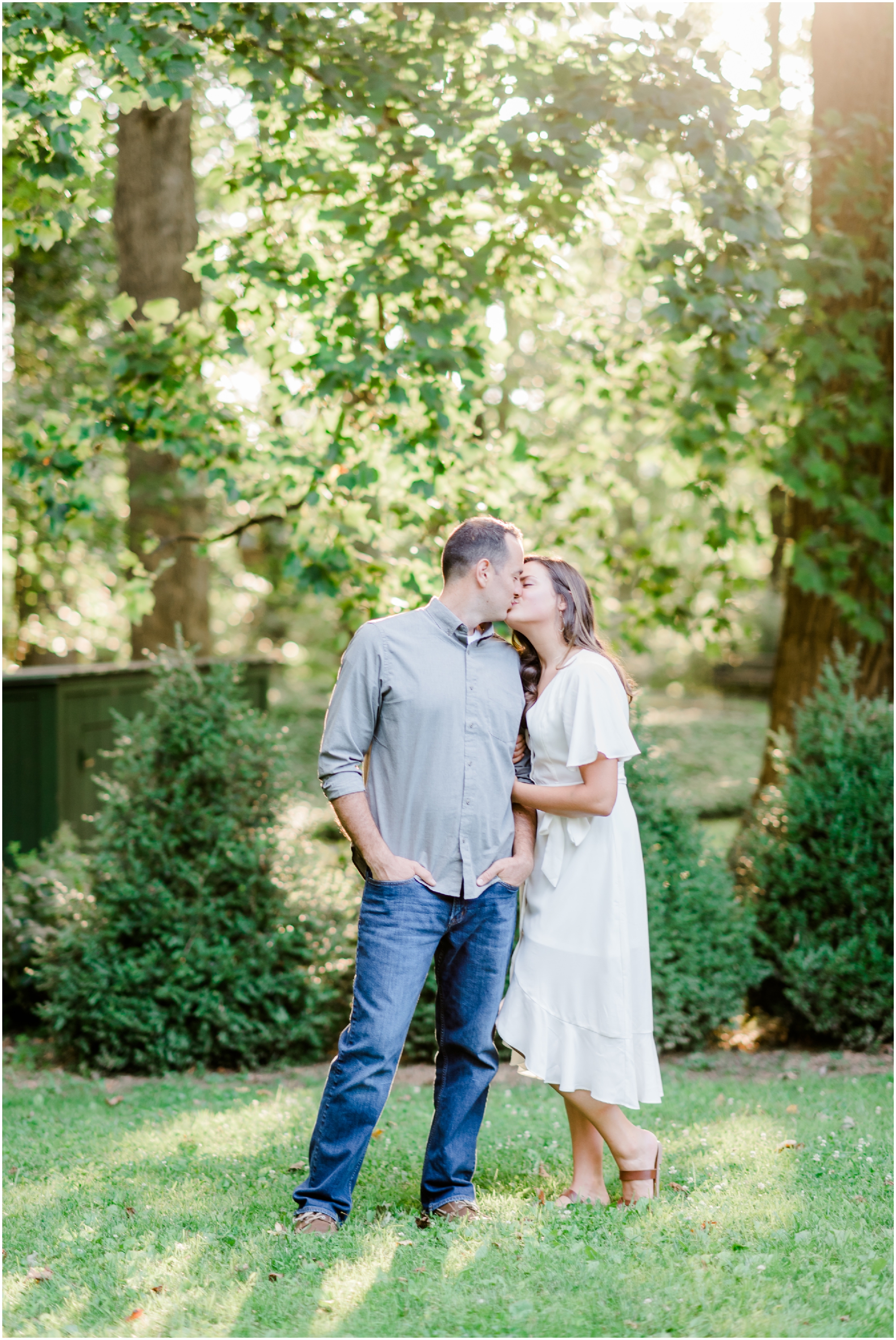 Elegant Summer Engagement Photo session at the Liriodendron Mansion in BelAir Maryland featuring a brunette couple and white dress by Maryland Wedding Photographer Megan Bennett Photography #liriodendronmansion #marylandweddingphotographer #belairmdphotographer