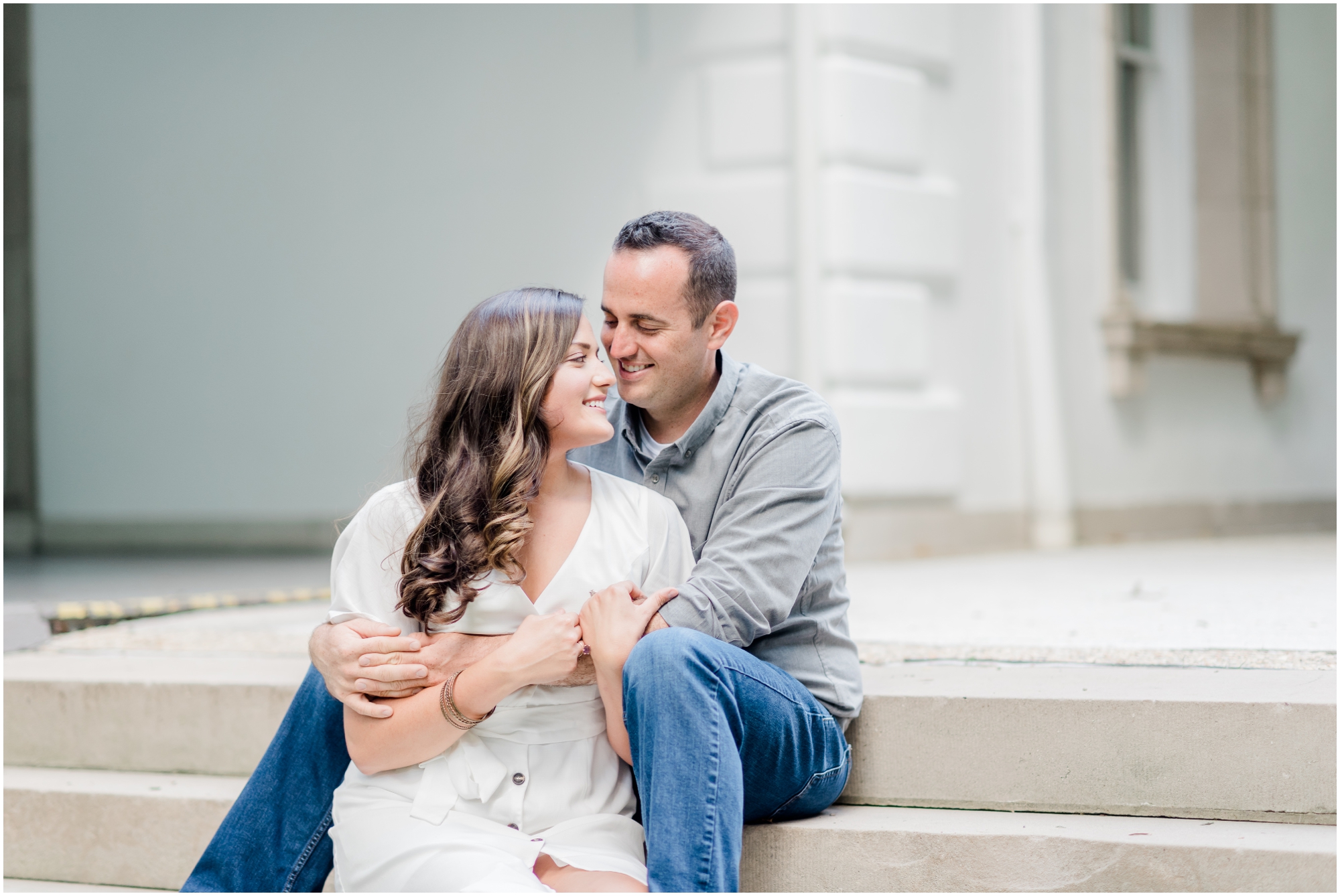 Elegant Summer Engagement Photo session at the Liriodendron Mansion in BelAir Maryland featuring a brunette couple and white dress by Maryland Wedding Photographer Megan Bennett Photography #liriodendronmansion #marylandweddingphotographer #belairmdphotographer