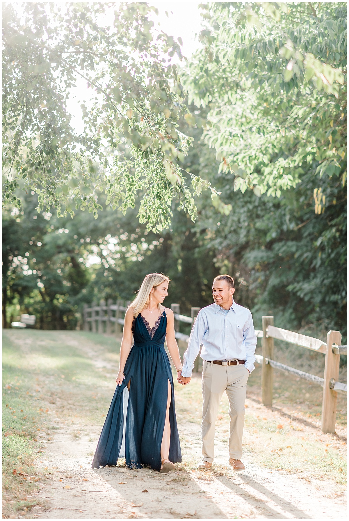 A sweet park engagement photo featuring a flowy navy blue dress and a grassy beach at Terrapin Park in Stevensville, Maryland by Maryland Photographer Megan Bennett Photography