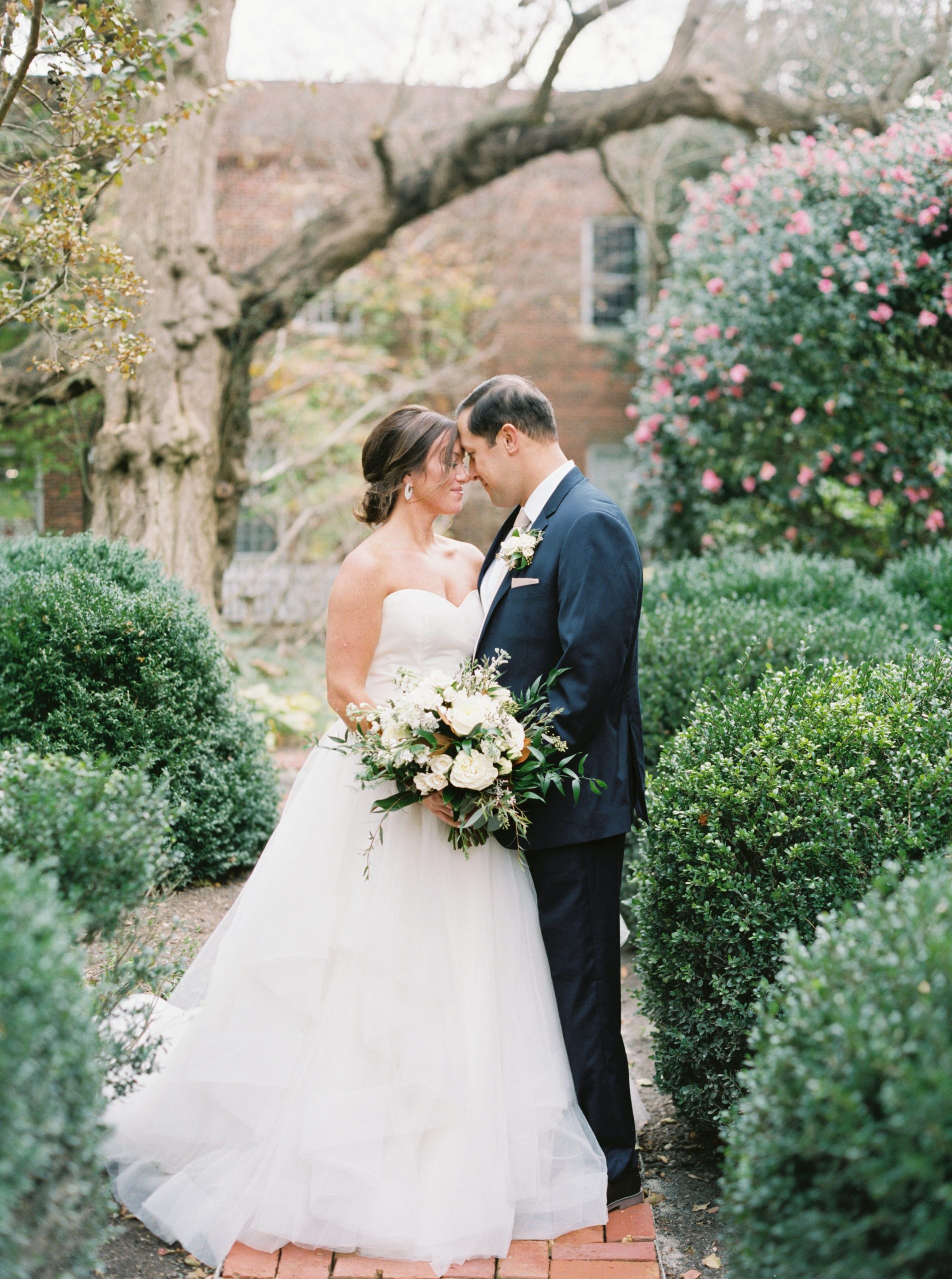 Romantic Tidewater Inn Wedding Photo of Bride and Groom in gardens by Film Photographer Megan Bennett Photography