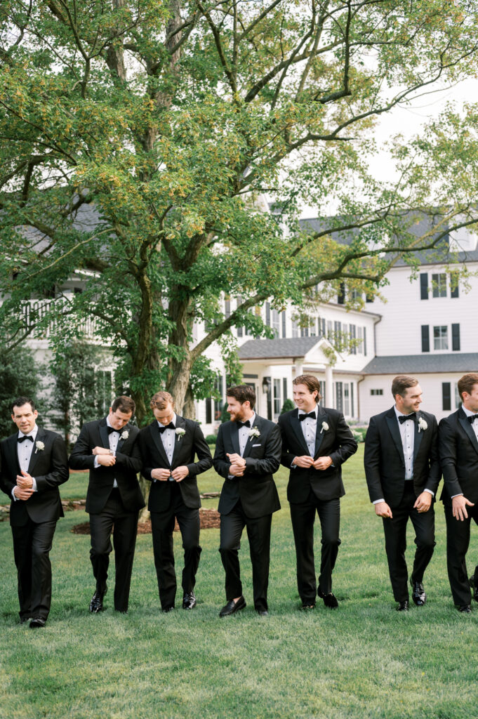 Groomsmen posing on the lawn